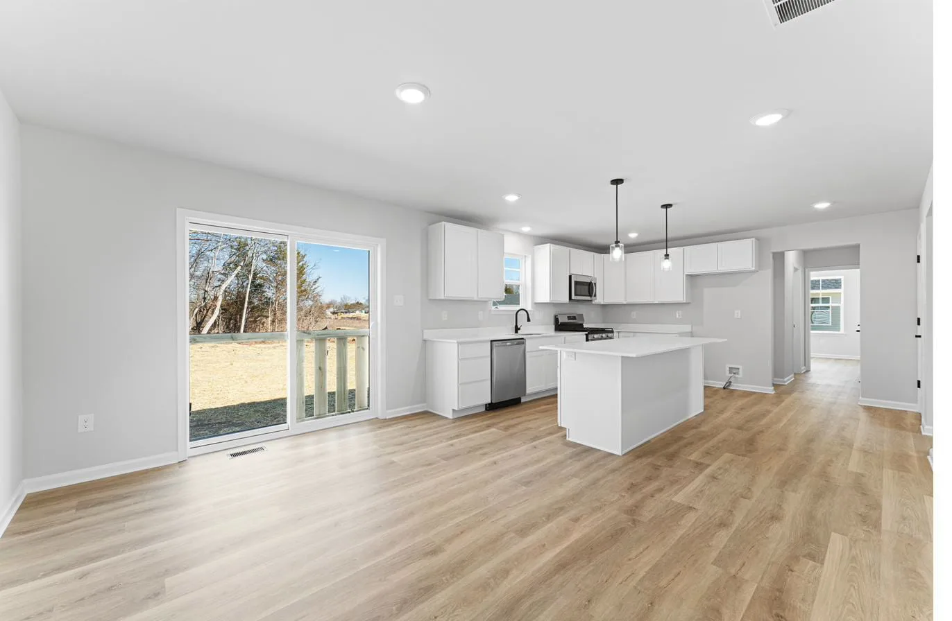 Isabella 2-car garage model kitchen with center island and patio slider — new construction Vineland NJ