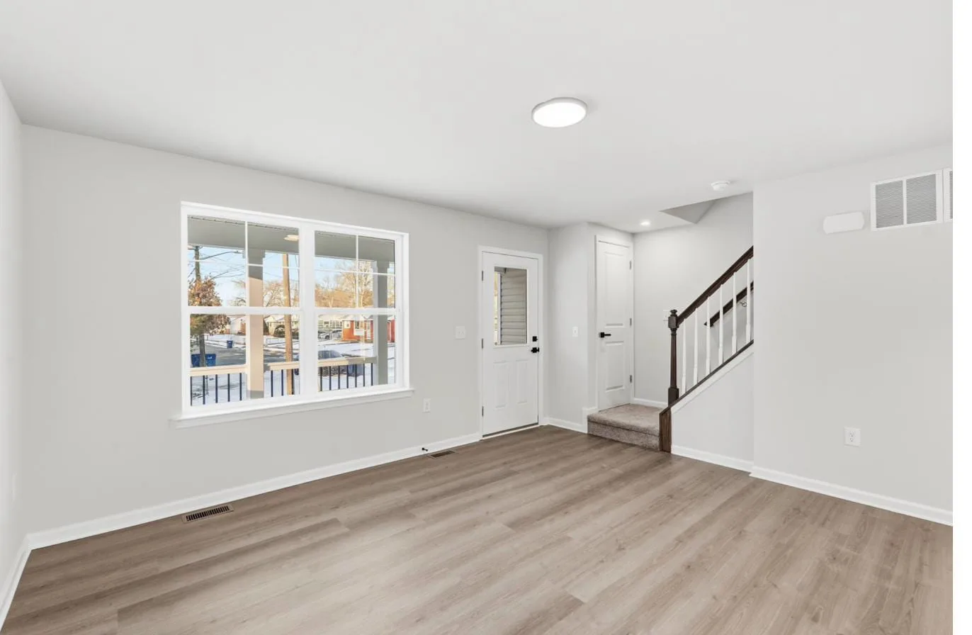 Chelsea model 1-car garage interior — living room and entry, new construction South Jersey