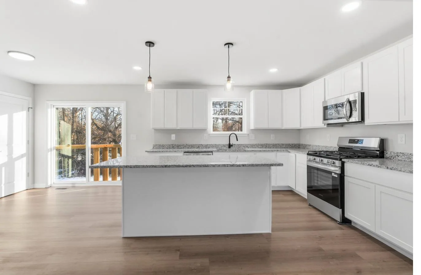 Chelsea 1-car garage model kitchen with center island — new construction South Jersey