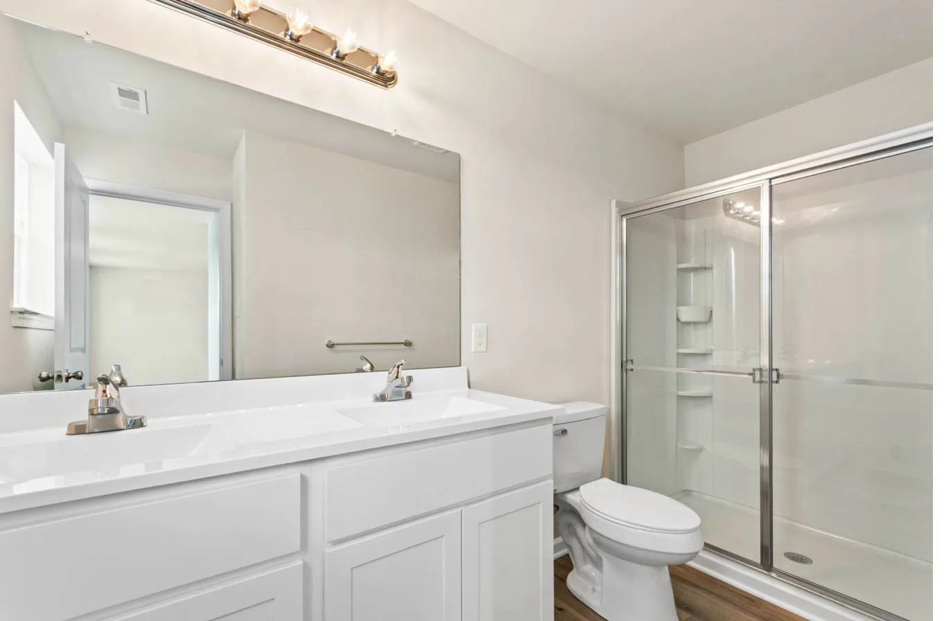 Chelsea 2-car garage model master bath with double vanity and walk-in shower — new construction South Jersey