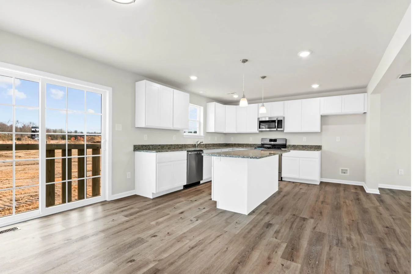 Chelsea 2-car garage model kitchen with center island and stainless appliances — new construction South Jersey