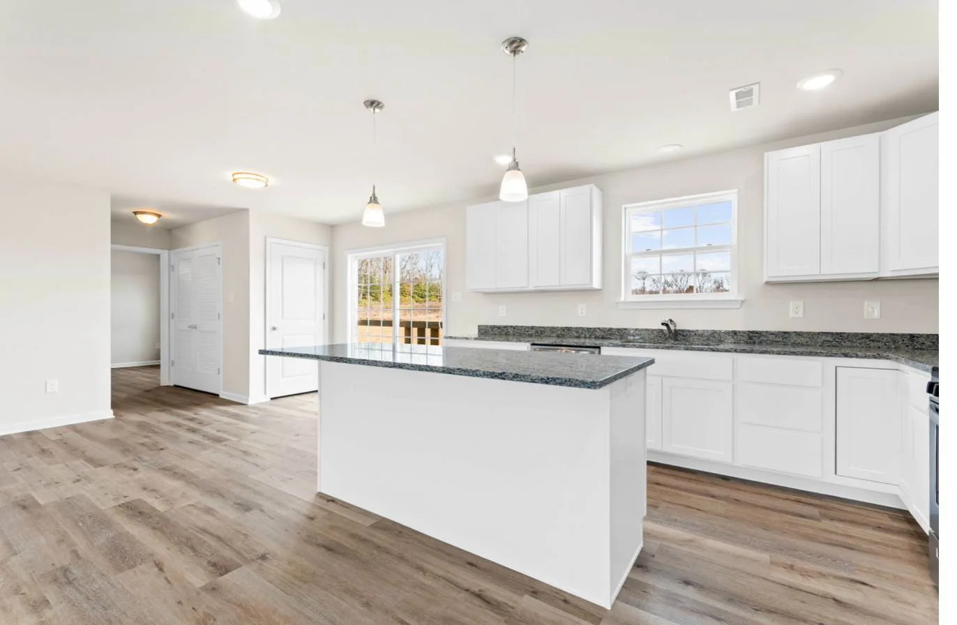 Chelsea 2-car garage model kitchen wide view with dining area — new construction South Jersey
