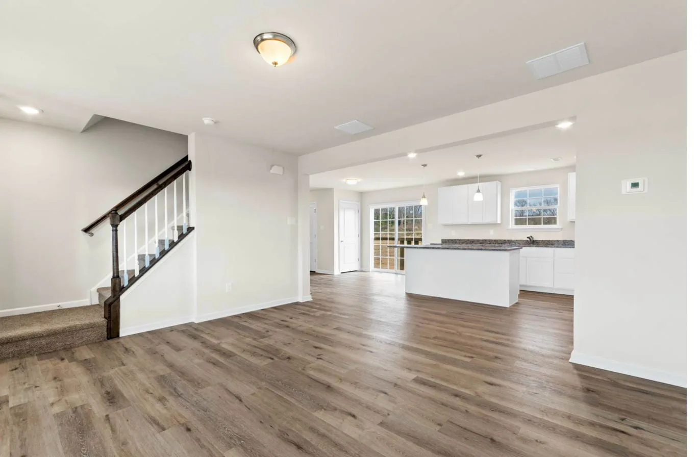 Chelsea model 2-car garage interior — living room open to kitchen, new construction South Jersey