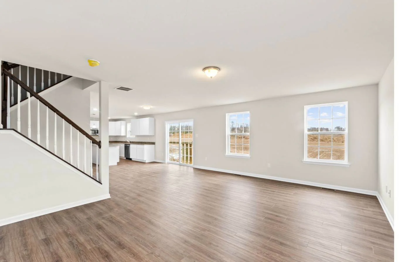 Cooper model living room open to kitchen with staircase — new construction South Jersey