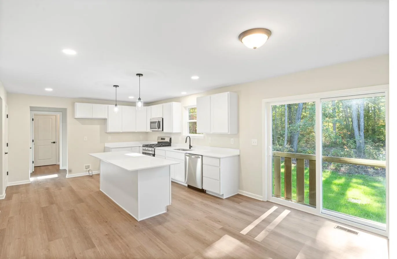 Isabella 1-car garage model kitchen with center island — new construction South Jersey