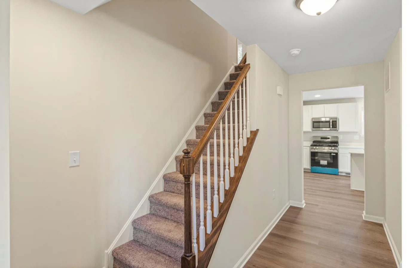 Isabella model 1-car garage interior — entry foyer with staircase, new construction South Jersey