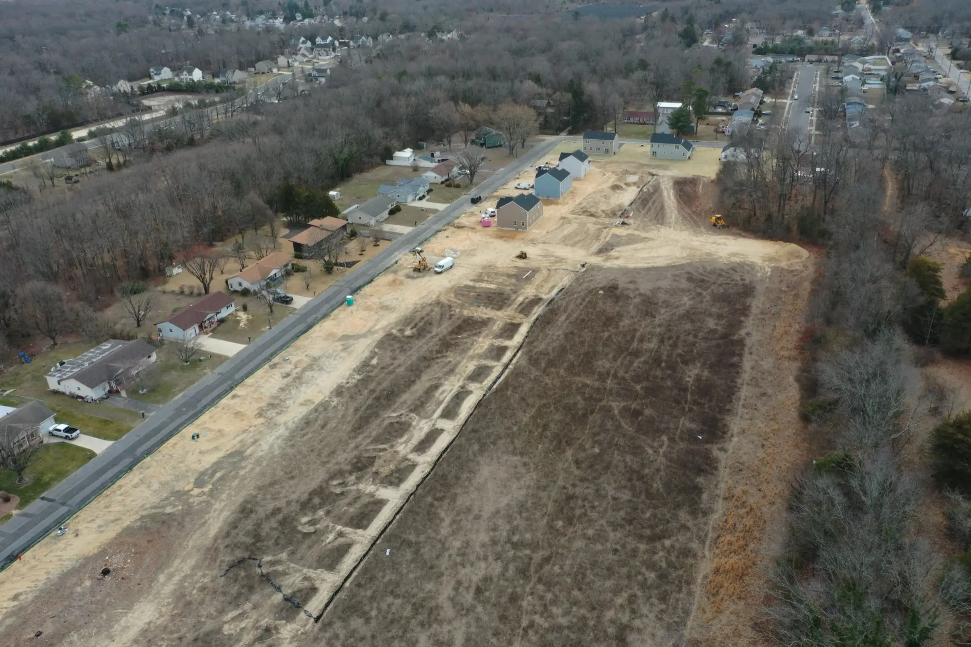 Aerial view of a graded land parcel being developed for new construction homes in South Jersey NJ